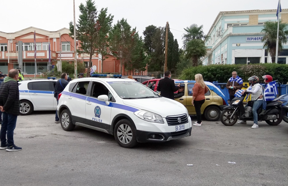 Police block members of the public with flags in Alykes, Potamos