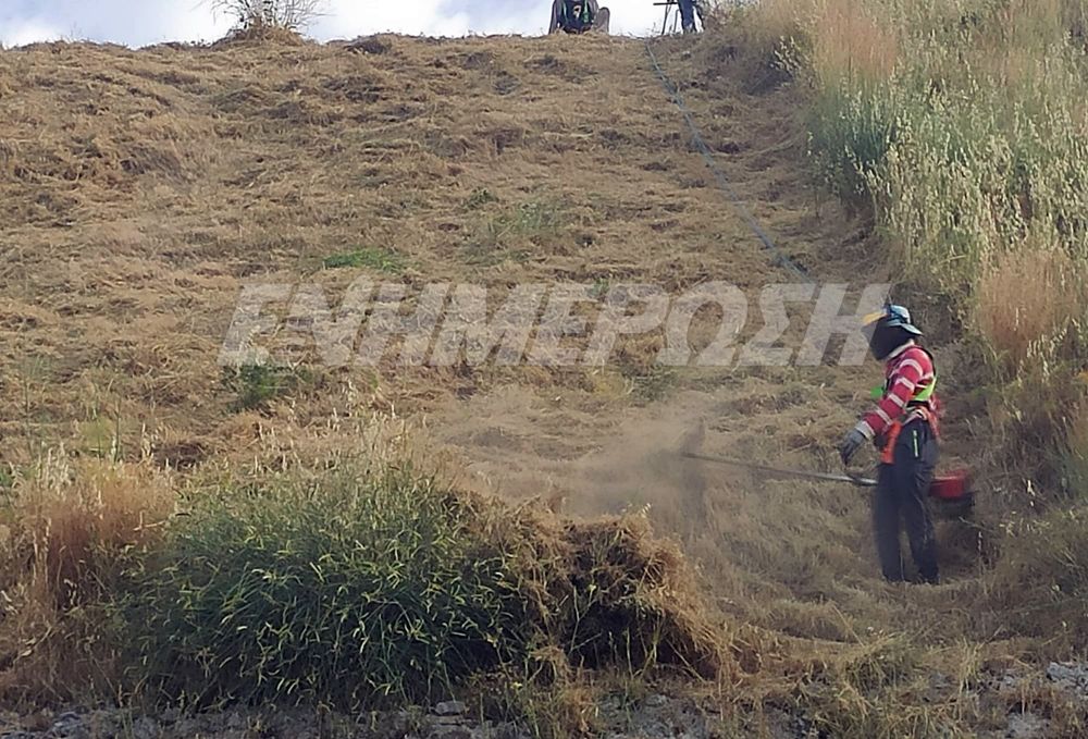Long grass being cut around New Fortress