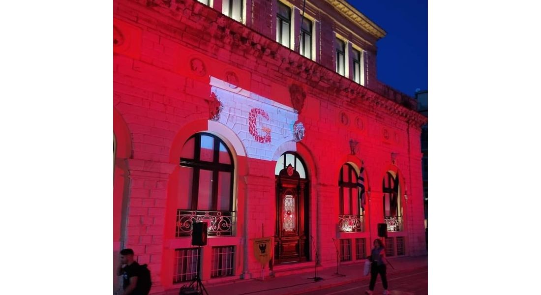 Old Town Hall lit up in red in memory of the Pontic Greek victims